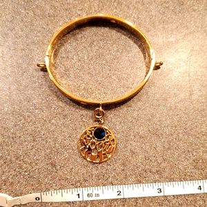 Goldtone bangle with charm